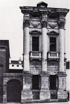 an old building with many windows and balconies