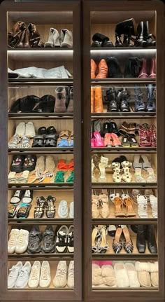 a closet filled with lots of shoes and slippers on top of wooden shelves next to each other