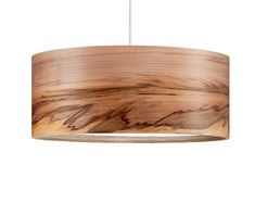 a wooden light hanging from a ceiling fixture with wood grain patterning on the bottom