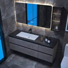 a bathroom with a sink, mirror and lights on the side walk in front of it