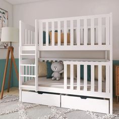 there is a white bunk bed with two drawers on the bottom and one under it