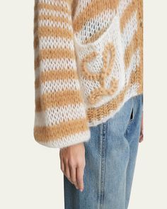 Loewe stripe cardigan with an anagram embroidery on the pockets    V neckline; button front    Long sleeves    Patch pockets    Relaxed fit    Mohair/wool    Made in Italy Stripe Cardigan, Mohair Wool, White Cardigan, Striped Cardigan, V Neckline, Wool Cardigan, Patch Pocket, Tops Designs, In Italy