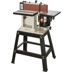 a table sawing machine sitting on top of a stool