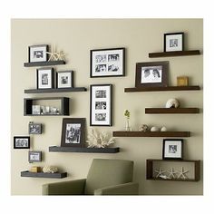 the wall is filled with pictures and frames