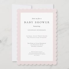 a pink and white baby shower card with scalloped edges