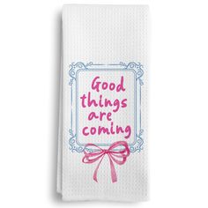 a white towel with the words good things are coming on it and a pink bow