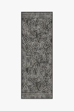 a black and white rug with an abstract design