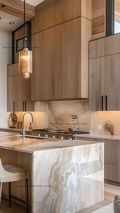 a modern kitchen with marble counter tops and wooden cabinetry, along with stools