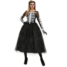 a woman wearing a skeleton costume with long sleeves and black tulle skirt, standing in front of a white background