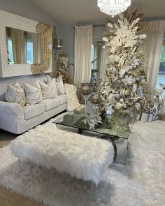 a living room filled with furniture and a christmas tree