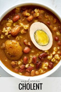 a bowl of soup with beans, corn and an egg on top that says vegetarian cho lentils