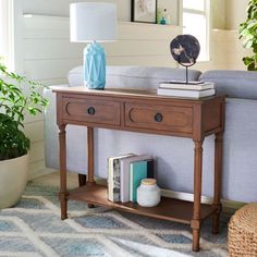 a living room scene with focus on the end table and sofa in the foreground