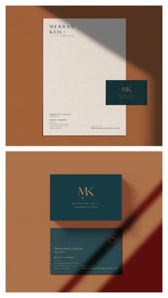 two business cards with the letter m on them, one in blue and one in brown