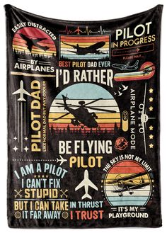 an airplane poster hanging on the side of a black wall next to a sign that says pilot