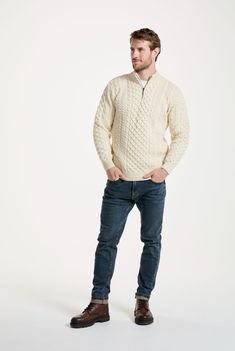 100% Merino, 100% luxury. The Ballycroy Aran Half Zip Sweater showcases a modern half zip cut, with an antique brass finished zip that fastens up to the top of the double ribbed collar. This contemporary style is balanced with traditional Aran cable, honeycomb and moss stitching, allowing the magic of Aran to weave its way into the current moment. Mastering the balance of two worlds. Half Zip Sweater Outfit, Zip Sweater Outfit, Aran Hat, Aran Cardigan, Mens Smart Casual Outfits, Half Zip Sweater, Smart Casual Men, Aran Sweater, Wool Shop