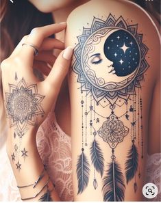 a woman's arm with tattoos and stars on the side, moon in the background