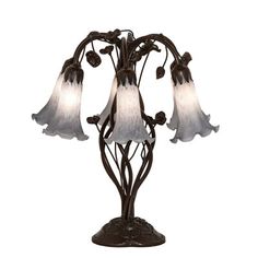 a lamp that is sitting on top of a metal stand with three flowers hanging from it