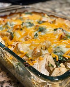 a casserole dish with chicken, cheese and spinach