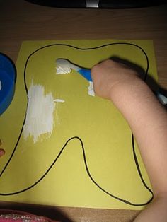 Tooth art, painting a yellow tooth with white paint ("toothpaste") and a toothbrush for a paintbrush. Tooth Art, Teeth Art, February Crafts