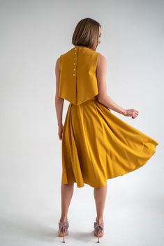 Mustard yellow dress consists of three parts - a top, an A-shaped skirt and an overtop. You can choose the top with or without the nursing option. The overtop is specially made for more discreet nursing but will also serve as an eye-catching accent even without the nursing option and will give you a well put together look. The dress has pockets and it can be transformed into three parts and worn separately so this set is perfect for traveling or as a sustainable piece in your capsule wardrobe. This timeless dress will live in your wardrobe forever due to the elegant and always-in-fashion fit. Materials: 60% viscose, 35% polyamide, 5% elastane, lining is made from 95% polyamide and 5% elastane. 34 = XS 36 = S 38 = M 40 = L 42 = XL 44 = XXL THIS DRESS CAN BE ORDERED BY STANDARD SIZING CHART Transforming Dress, Mustard Yellow Dress, Mustard Yellow Dresses, Yellow Dresses, Timeless Dress, Nursing Dress, Fashion Fits, Three Piece, Dress Clothes For Women