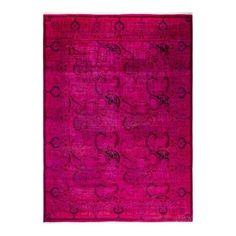 a pink rug with an intricate design on the front and back side, in different colors