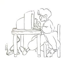 a person sitting at a desk using a computer