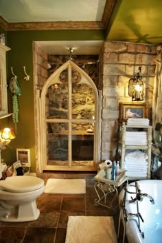 a bathroom with an arched window and stone walls