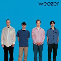 four men standing in front of a blue background with the word weezer on it