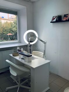 a white desk with a light on top of it