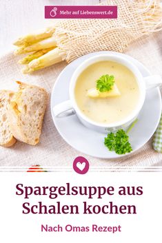 a white plate topped with soup next to bread