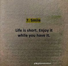 a sign that says, 7 smile life is short enjoy it while you have it