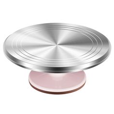 a round metal object with pink base