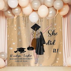 a graduation photo backdrop with balloons and a graduate's cap in the background, she did it