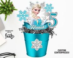 the frozen princess is sitting in a blue bucket with snowflakes on it's head