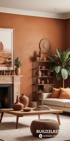 a living room with an orange wall and white furniture in the center, surrounded by potted plants