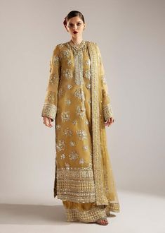 Introducing our Women's Premium Quality Pakistani Indian wedding bridal party dresses, perfect for mehndi, nikkah, engagement, reception, barat, walima, sangeet, mayu and everyday wear, available in all sizes, order now! a timeless piece crafted for those who appreciate classic style and superior craftsmanship. Inspired by the iconic design, these dress made in different style, lehenga, maxi, gown, sharara, saree, salwar kameez making it an essential addition to any wardrobe. Color:  Lime Yellow Material:  Embroidered Hand Embellished Kameez front (Organza) Embroidered Kameez back (Organza) Embroidered Hand Embellished Sleeves (Organza) Embroidered Organza Dupatta Silk crush Trouser Replicate design by Chamki Style Dresses NOTE: Color of this outfit may slightly vary due to photographic li Festive Gold Churidar With Chikankari Embroidery, Gold Salwar Kameez With Chikankari For Navratri, Navratri Gold Salwar Kameez With Chikankari Embroidery, Gold Unstitched Suit With Dabka Work For Transitional Season, Floor-length Organza Churidar For Eid, Eid Shantoon Churidar With Intricate Embroidery, Festive Shantoon Salwar Kameez With Intricate Embroidery, Gold Floor-length Kurta For Eid, Festive Chikankari Embroidery Churidar In Shantoon