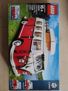 a red and white lego car is in the box