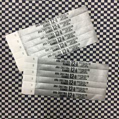 four tickets sitting on top of a checkered table