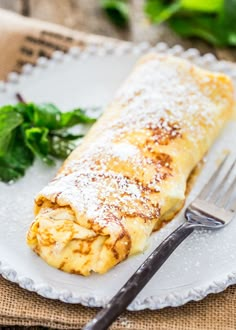 an omelet on a plate with a fork