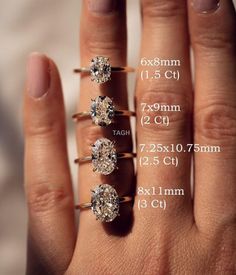 three different sizes of engagement rings on someone's hand with measurements for each ring