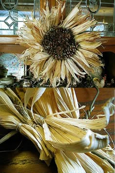 a sunflower sitting on top of a wooden table