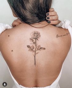 a woman with a tattoo on her back