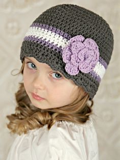 This handmade gray, grape, white, & lavender striped flapper beanie flower hat is crocheted in baby, toddler, girl, & women's sizes. This lightweight beanie is a unique baby shower gift, hospital cap for a coming home outfit, or darling prop for baby's first photos. This pretty cap is also great for everyday wear and will keep your head warm on those chilly spring, fall, autumn, and winter days. Girls Hat Pattern, Crochet Baby Cap, Baby Winter Hats, Crochet Kids Hats, White Lavender, Crochet Beanie Pattern, Cap Patterns, Flower Hat, Crochet Cap