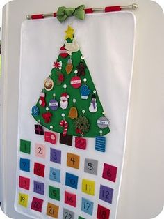 a christmas tree made out of magnets on a refrigerator