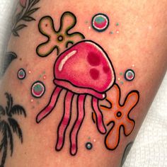 an octopus and jellyfish tattoo on the leg