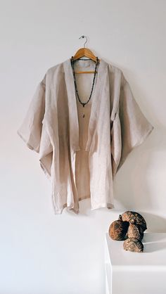 The 'Mala' Kimono  - is a one off a,  kind handmade kimono, created in delicate gentle woven linen, slightly transparentand perfectly suited for hot summer evenings.  If you are a lover of the finer things in life, then this one-off lustworthy piece of art could be the jewel of your wardrobe. A deliciously decadent robe dedicated for the dreamers and gypsies.  100% Linen - one size fits AU6 - AU12 -  is a short kimono just covers to the beginning of the thigh, below the buttock area If you aren't sure of the size, send me your measurements. Kimono hand made in Australia One of a kind creation Bohemian Linen Kimono For Vacation, Long Summer Kimono With Natural Dye, Elegant Linen Kimono For Summer, Elegant Linen Summer Kimono, Beige Linen Kimono For Beach, Beige Linen Beach Kimono, Linen Kimono With Kimono Sleeves For Vacation, Bohemian Linen Kimono For Beach, Linen Wrap Kimono For Vacation