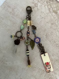 a key chain with charms attached to it