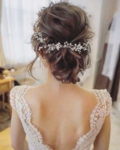 the back of a woman's head wearing a bridal hair comb