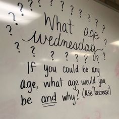 a white board with writing on it in an office building that says what age wednesday? if you could be any age, what age would you be and why?