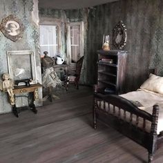 an old fashioned bedroom with wooden floors and wallpaper